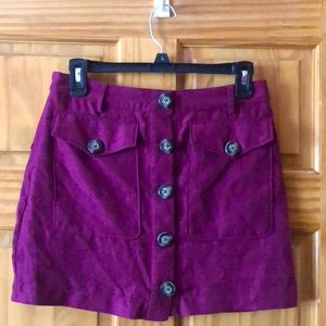 Purple buttoned mini skirt